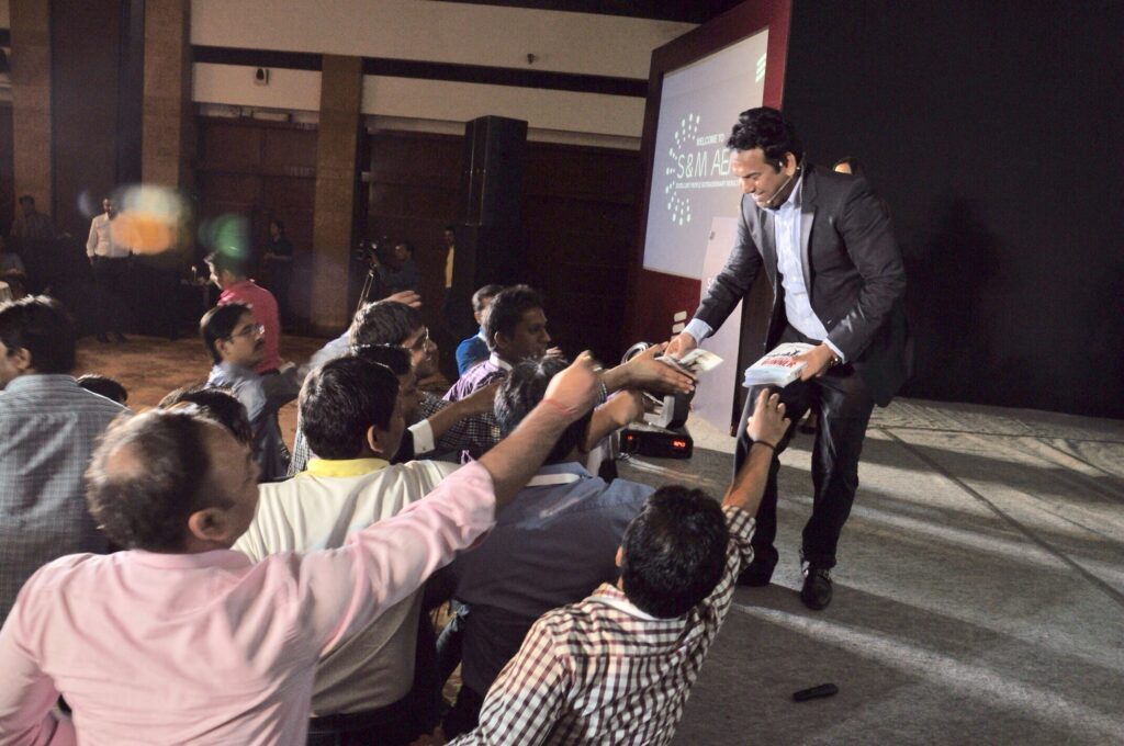 Paul Robinson handing over his best selling books